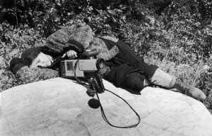 Alanis Obomsawin rests on a rock beside the Lake of Two Mountains, Kanehsata:ke, 1990  | Photo: John Kenney